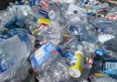 a wasteland of used, crushed plastic bottles