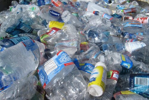 a wasteland of used, crushed plastic bottles