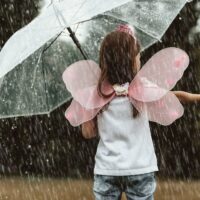 A little girl in the rain