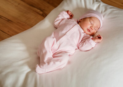 A baby in a pink onesie