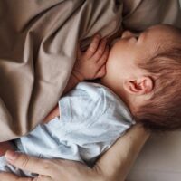 A mother breastfeeding her baby