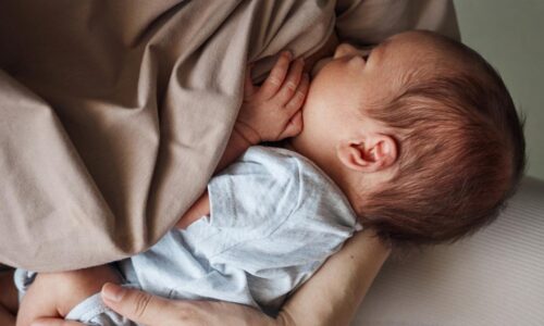 A mother breastfeeding her baby