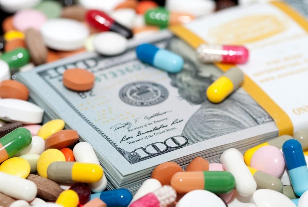 Pills and 100 dollar bills