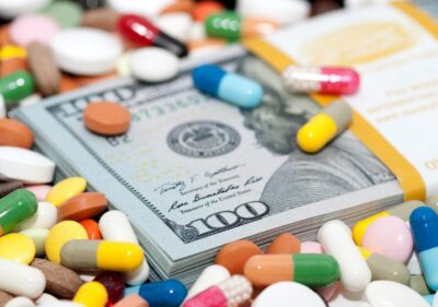 Pills and 100 dollar bills