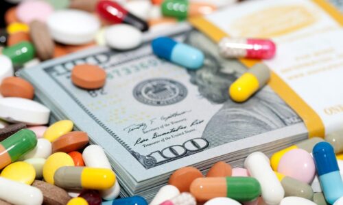 Pills and 100 dollar bills