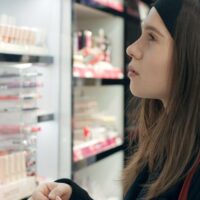 A woman looking at a display of personal care products