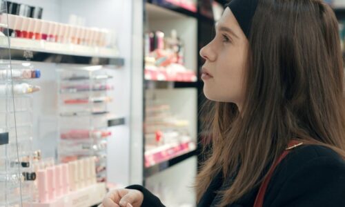 A woman looking at a display of personal care products